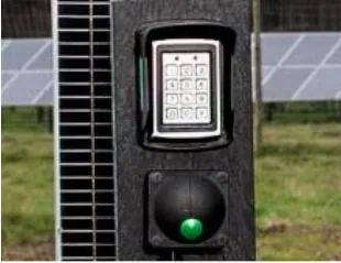Large green push button below a keypad on a barrier post