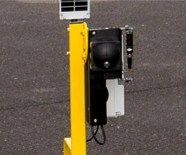 Intercom unit mounted on a yellow barrier post